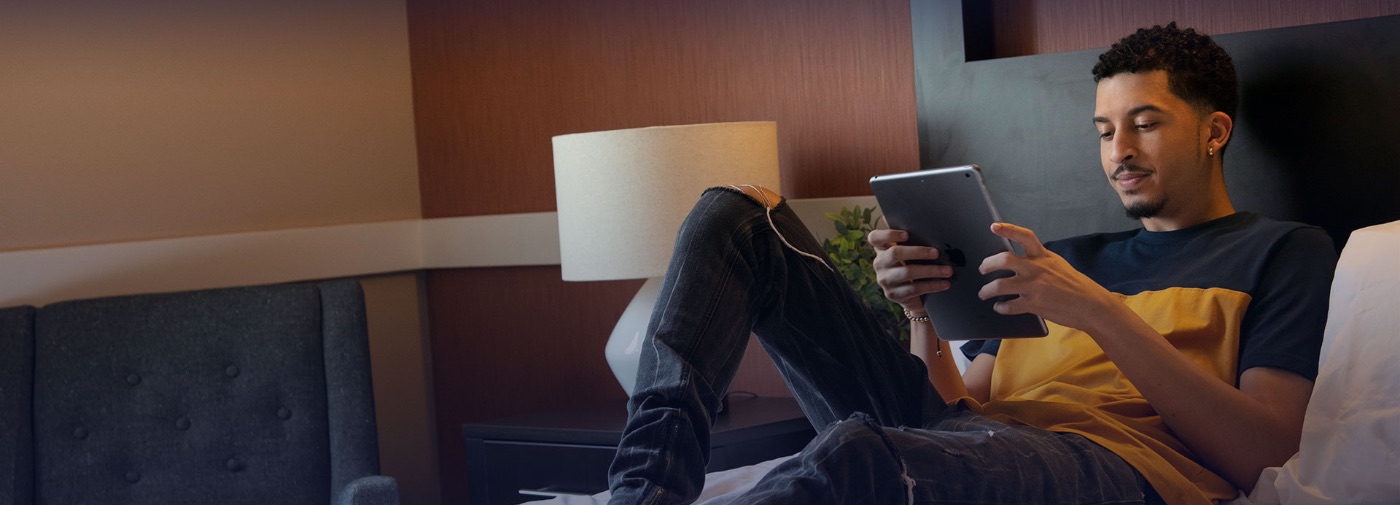 Patient at Sunrise Detox Palm Beach reading on his bed
