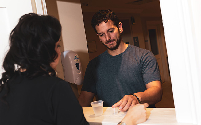 patient with a nurse getting medications in Palm Beach